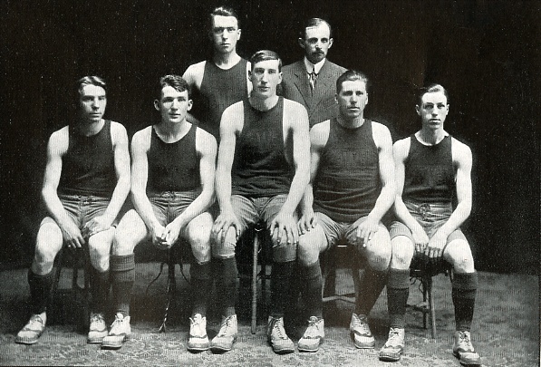 The undefeated team of 1910, Lynch towering over his teammates (1910 Log)