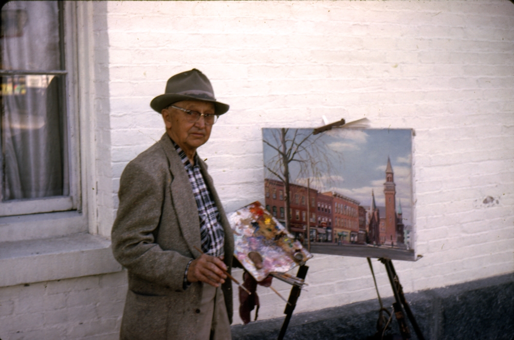 Albert Kiesling next to the Easthampton Congregational Church, working on a view of Shop Row.
