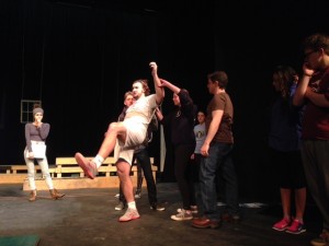 Fight director Jeff Lord teaches members of the cast (Henning Fischel '17 and Sarah Lucia '16) how to catch Orlando (John Kay '15) during the wrestling scene. 