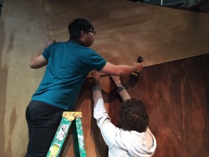 Long Nguyen '16 and AK Hafez '16 remove the first layer of the main wall. 