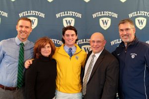 Ian Ostberg with parents Carol and Robert Osberg and coach Matthew Sawyer and Athletic Director Mark Conroy