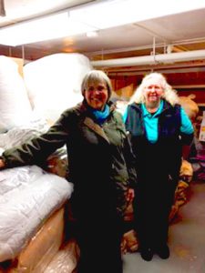 Williston's Ann Truehart and Easthampton Community Center Executive Director Robin Bialecki with a lot of bedding