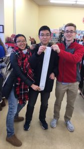 Sophomores Glede Wang, Simon Kim, and Robby Hill, shopped for food to donate before winter break. 